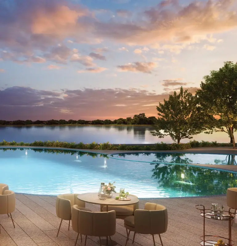 Pool bar and swimming pool beside a lake at sunset, Lodha Elanza